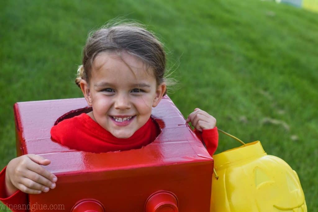 little girl in a lego halloween costume