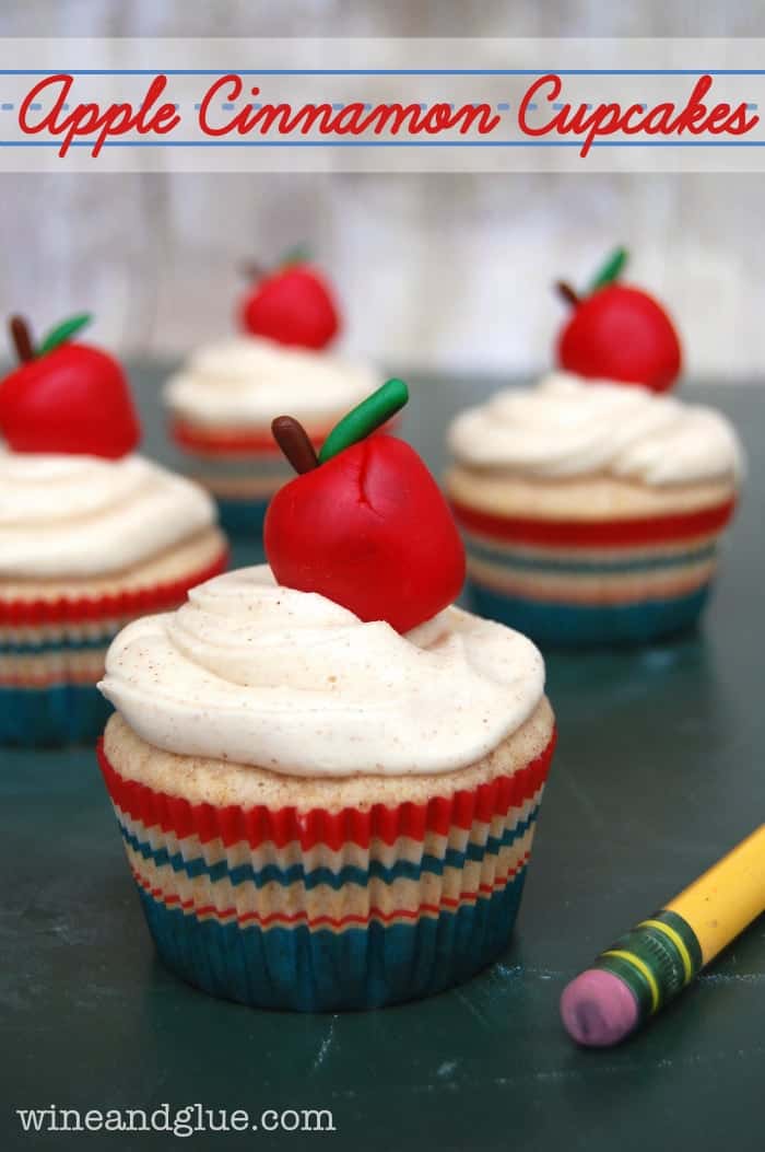Apple Cinnamon {Back to School} Cupcakes | Delicious apple cinnamon cupcakes that are filled with apples and topped with cute little apples made from Wilton Shape-N-Amaze Decorating Dough! via www.wineandglue.com