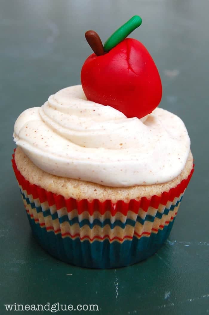 Apple Cinnamon {Back to School} Cupcakes | Delicious apple cinnamon cupcakes that are filled with apples and topped with cute little apples made from Wilton Shape-N-Amaze Decorating Dough! via www.wineandglue.com