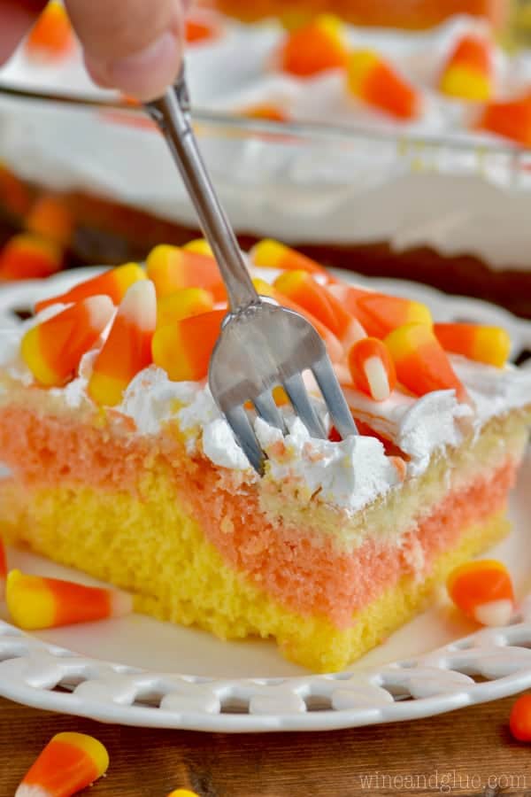 Candy Corn Poke Cake!  The perfect Halloween dessert that is super easy to make but has a big wow factor!!