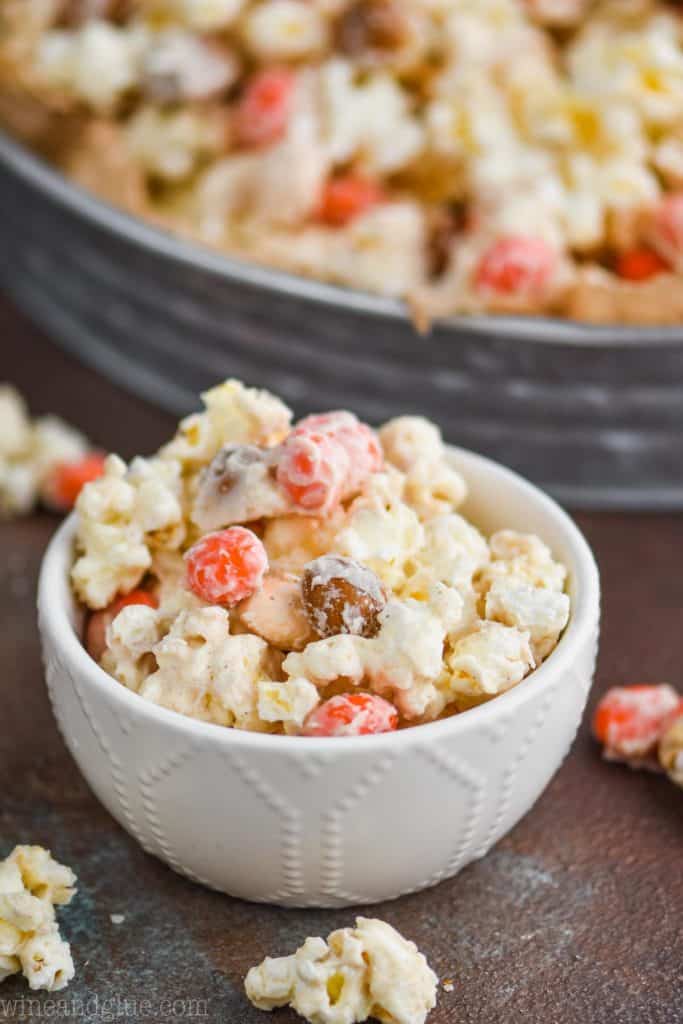 a small bowl full of a white chocolate popcorn recipe