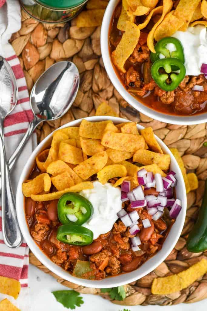 overhead view of a bowl of the best turkey chili pilled with toppings 