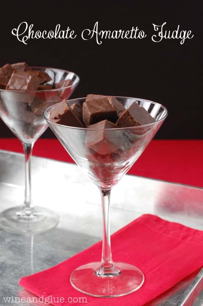 martini glass filled with chocolate amaretto fudge, with another in the background, says: chocolate amaretto fudge