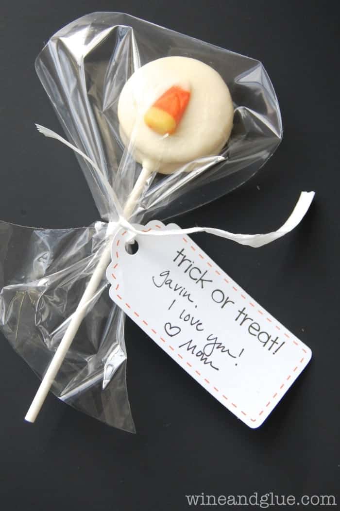 Candy Corn Pops!  A fun Halloween treat complete with free printable tags! via www.wineandglue.com