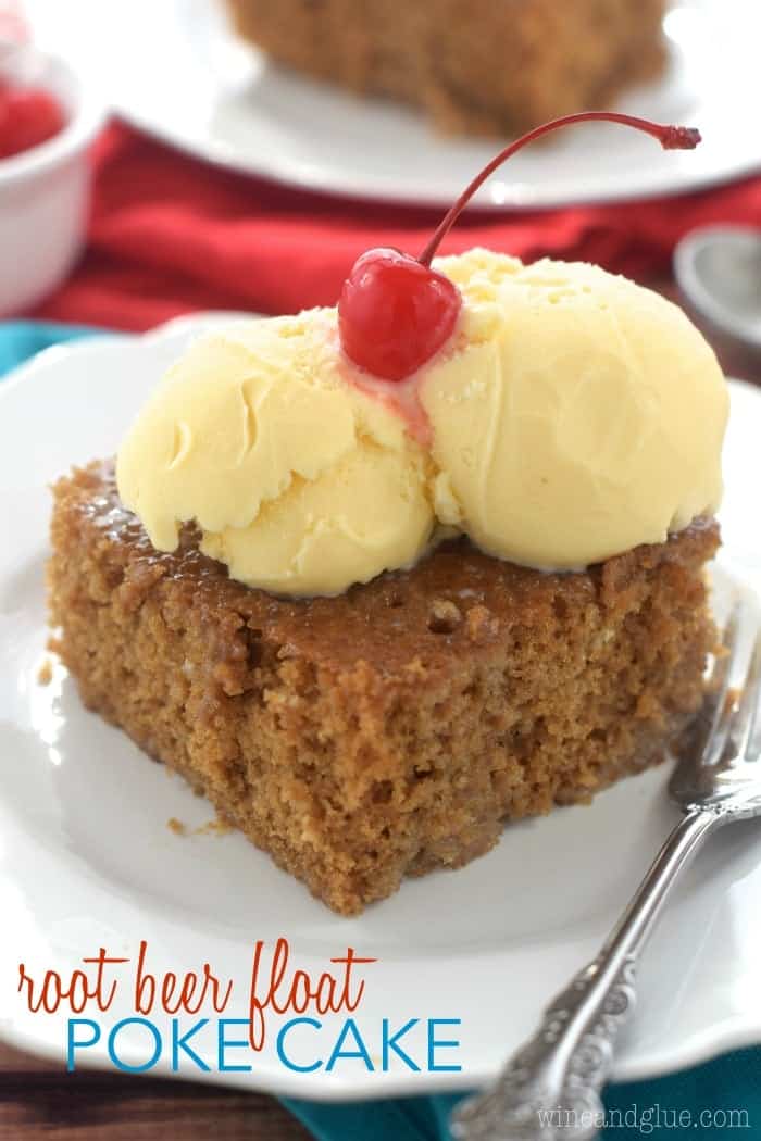 close up of square piece of brown cake with two scoops of vanilla frosting on top and a cherry, picture says "root beer float poke cake"