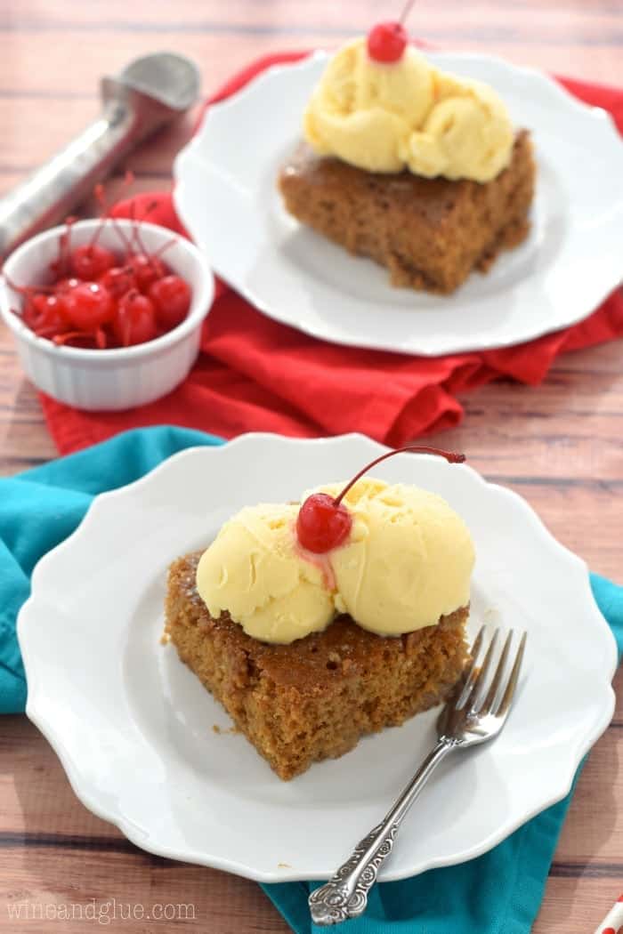 two pieces of root beer float poke cake on white plates