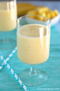 In a glass, the Pina Colada Smoothie has a pastel yellow color. 