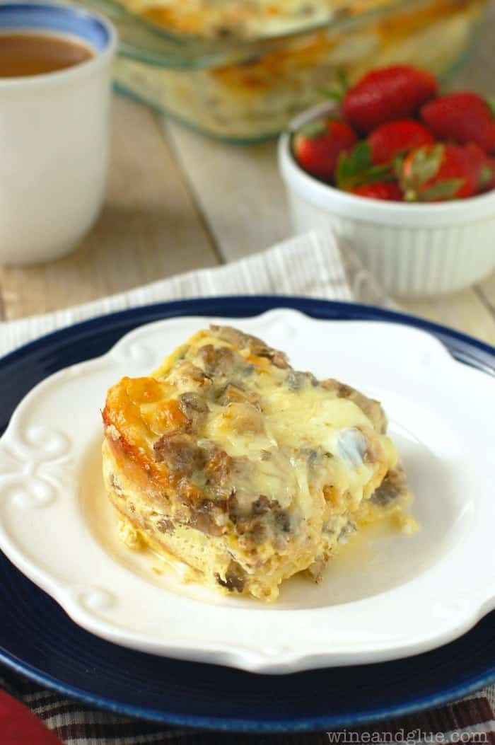 white plate with sausage and mushroom breakfast strata