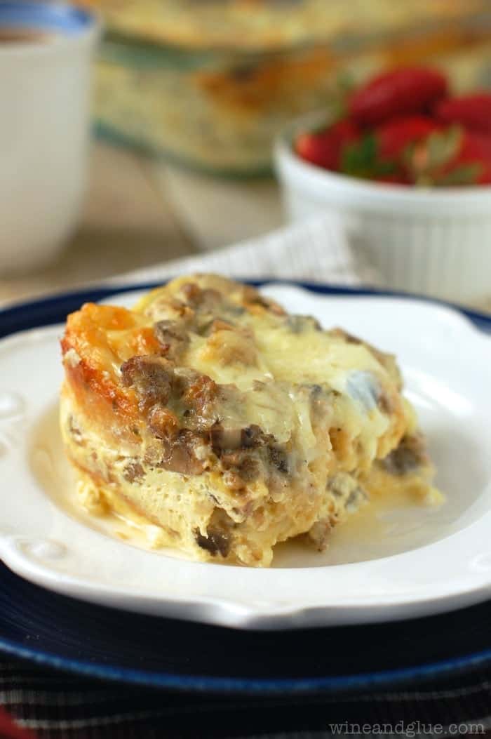 white plate with sausage and mushroom breakfast strata