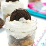 close up of cookie dough cheesecake in a small mason jar