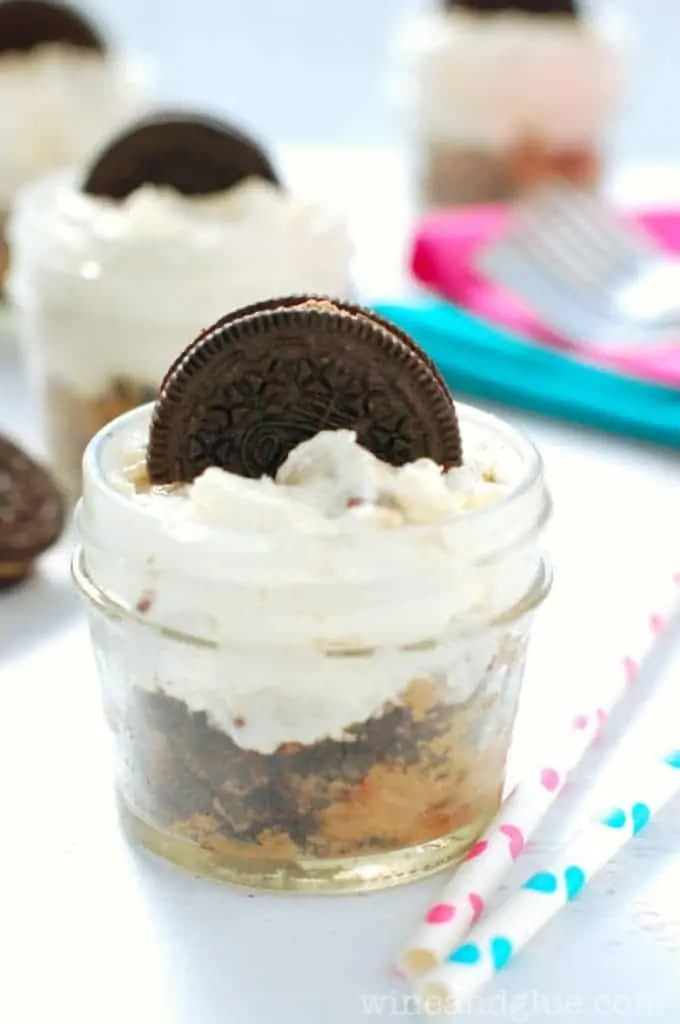 close up of cookie dough cheesecake in a small mason jar