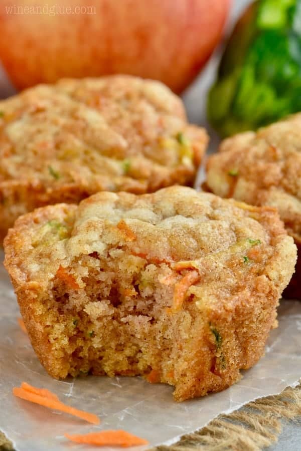 a zucchini carrot muffin with a bite taken out of it