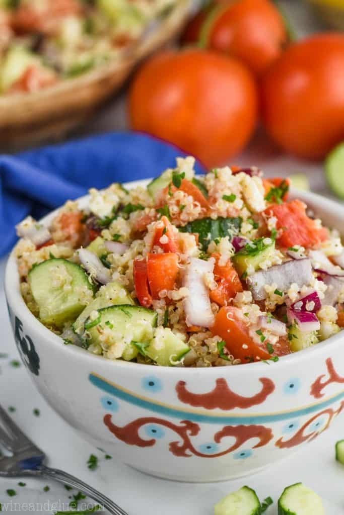 Mediterranean quinoa salad in a decorative white bowl