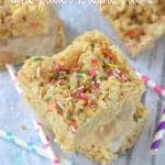 overhead view of a stack of cookies and cream Rice Krispie Treats with sprinkles on top, says: cookies and cream cake batter Krispie treats