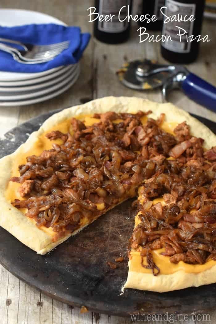 Beer Cheese Sauce pilled high with spicy sausage, bacon, and caramelized onions!