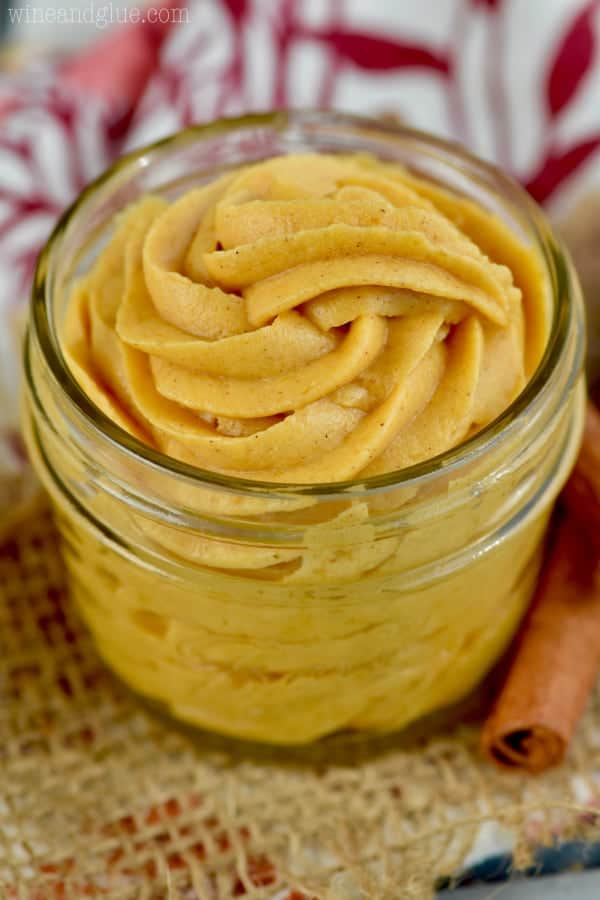 pumpkin frosting that has been piped into a small mason jar