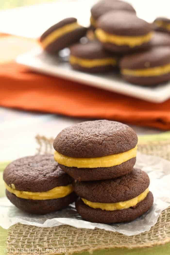 Pumpkin Oreos | www.wineandglue.com | Delicious chocolatey cookies that sandwich perfect with wonderful pumpkin buttercream.