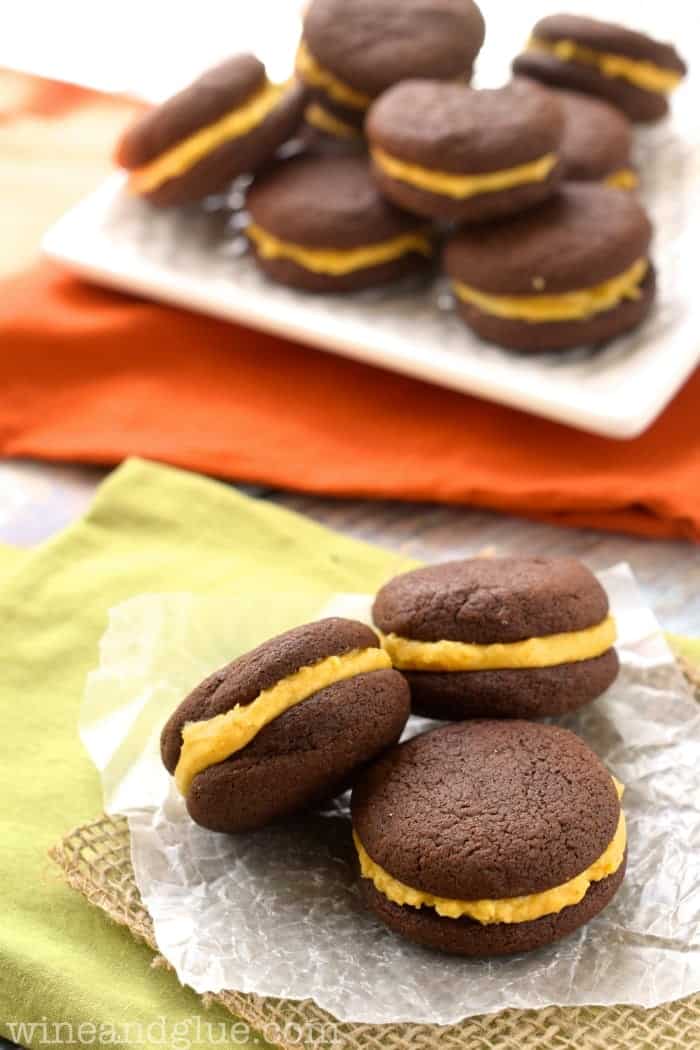 Pumpkin Oreos | www.wineandglue.com | Delicious chocolatey cookies that sandwich perfect with wonderful pumpkin buttercream.