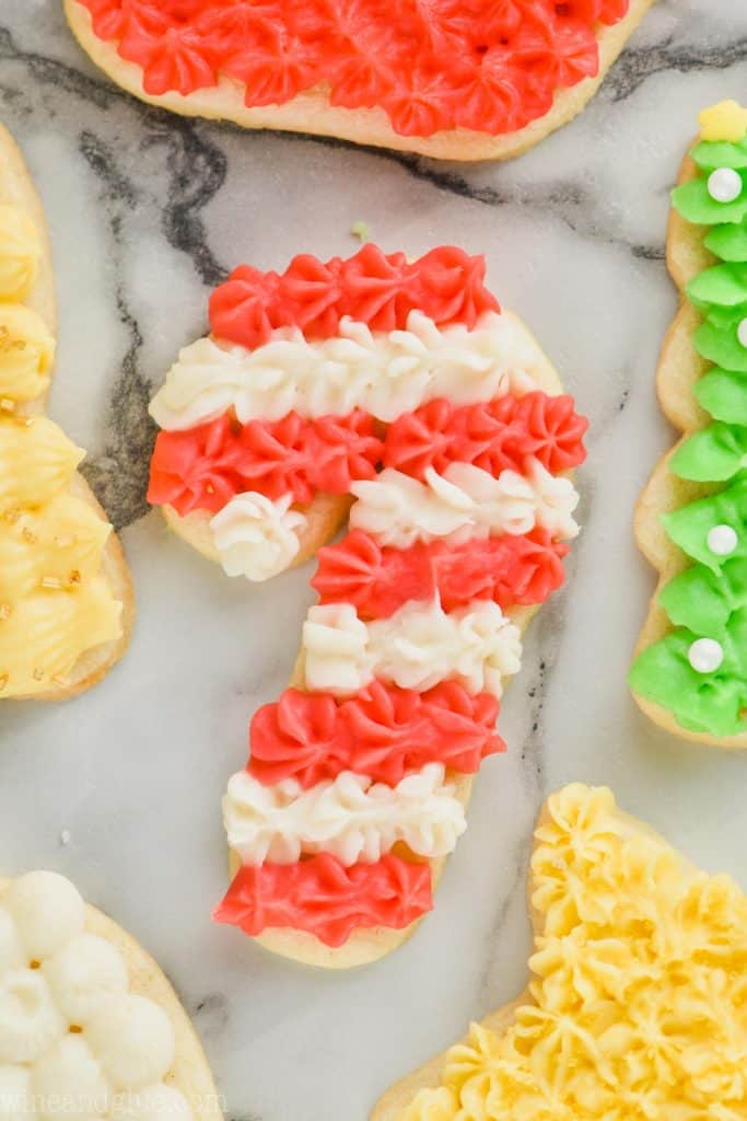 candy can shaped sugar cookie frosted red and white