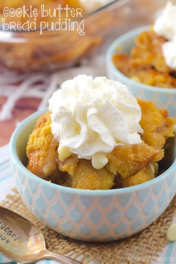 Small bowl with cookie butter bread pudding and topped with whipped cream, photo says: cookie butter bread pudding