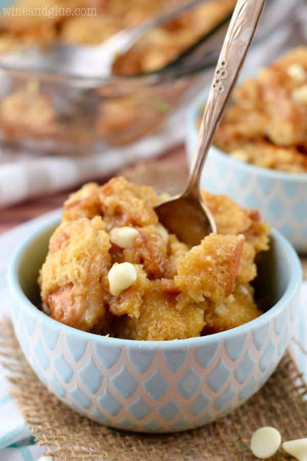 small bowl with cookie butter bread pudding with a spoon sticking out of the top