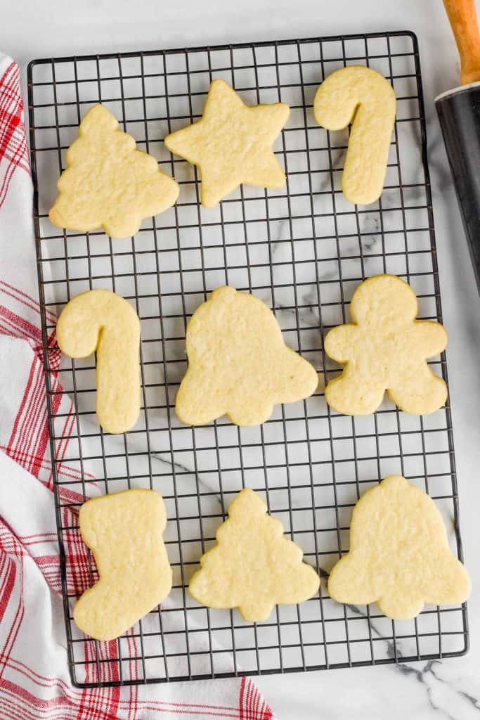 unfrosted cut out sugar cookies on a cooling wrack