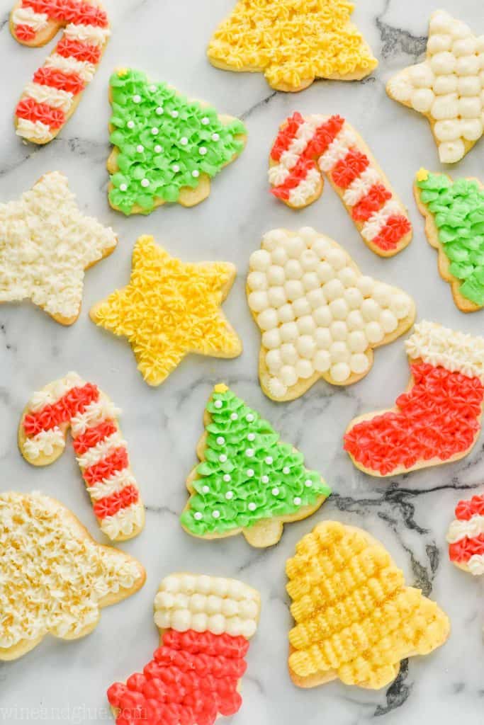 overhead view of a lot of soft cut out sugar cookies that have been frosted and decorated