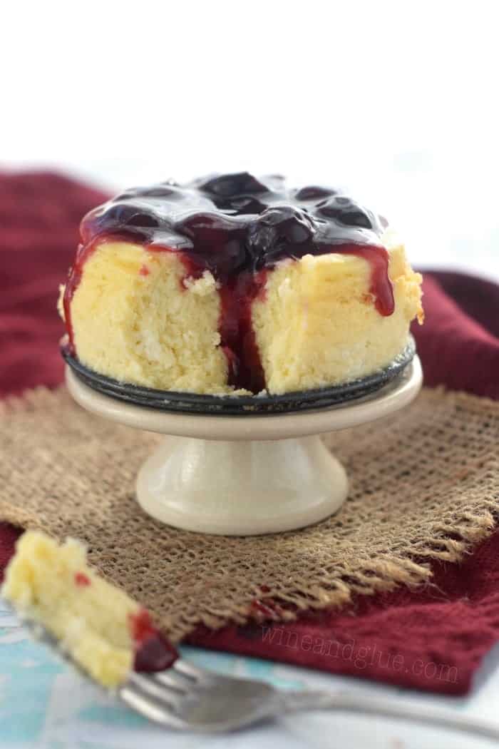 This cute little Mini Cheesecake is just perfect for you and your date! Delicious, creamy, and topped with homemade cherry sauce!