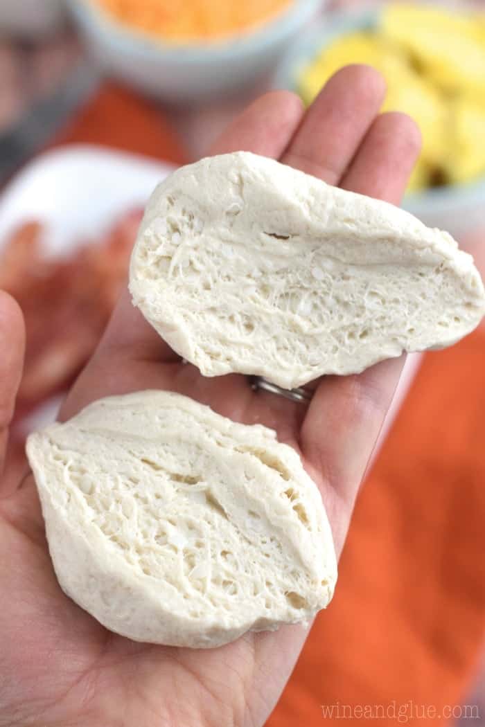 raw biscuit dough cut in half