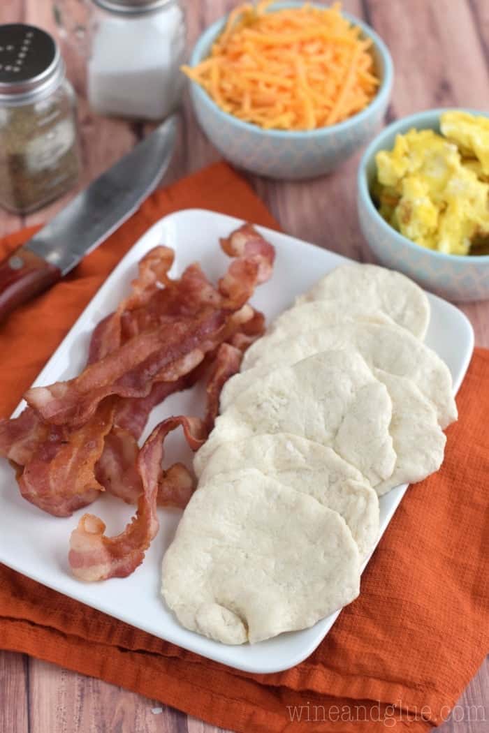 This Bacon and Eggs Biscuit Breakfast Panini is FOUR ingredients, and and all but the last two steps can be done ahead of time making it a fast breakfast!