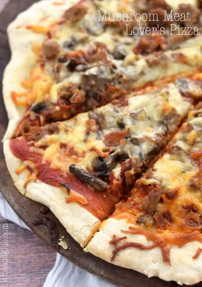 close up of meat lovers pizza, with one piece cut