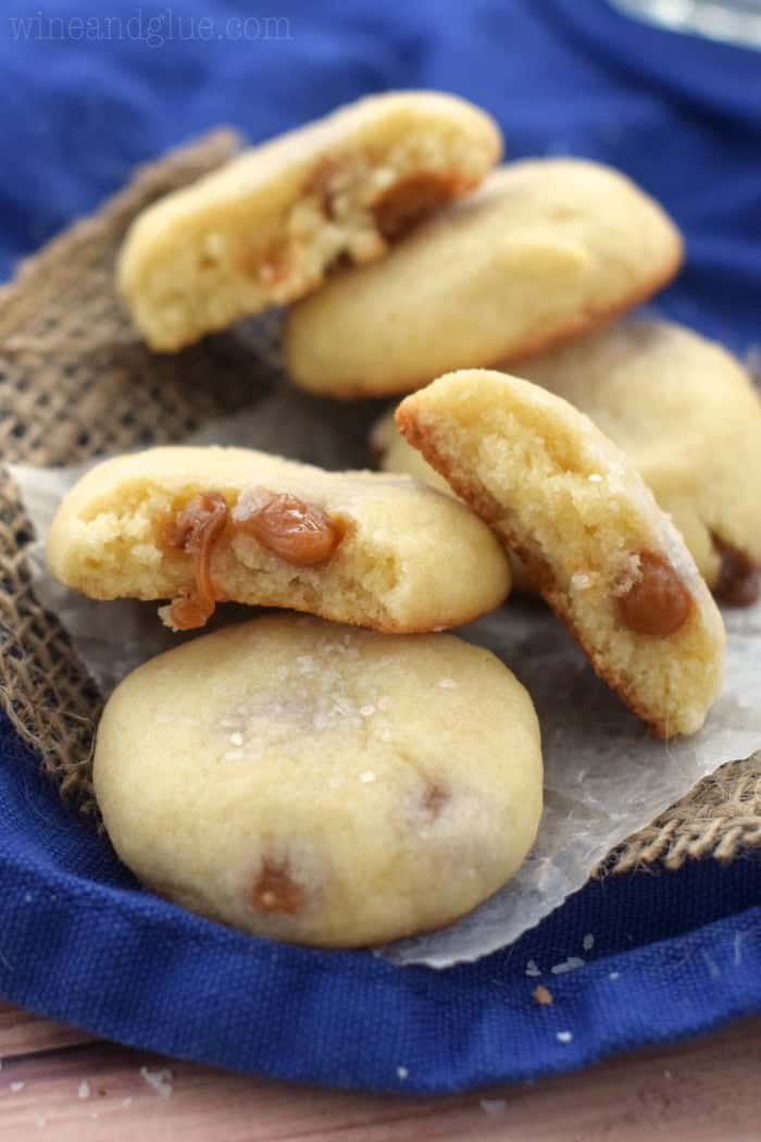 a pile of salted caramel sugar cookies with two broken in half