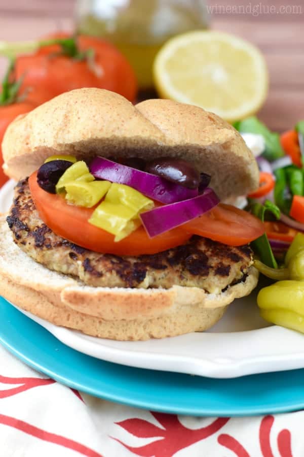 These Feta Stuffed Greek Turkey Burgers are PACKED with amazing flavor!  They are perfect for summer grilling!
