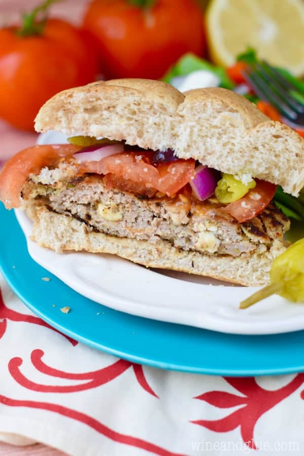 These Feta Stuffed Greek Turkey Burgers are PACKED with amazing flavor!  They are perfect for summer grilling!