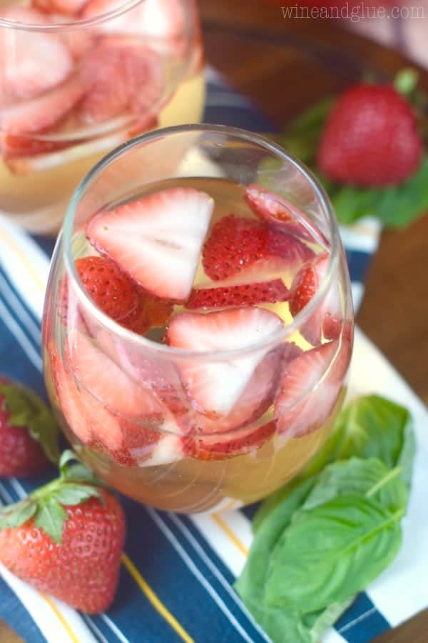 Such a perfect and easy summer cocktail! This Strawberry Basil Sangria is exactly what your summer BBQ or picnic needs!