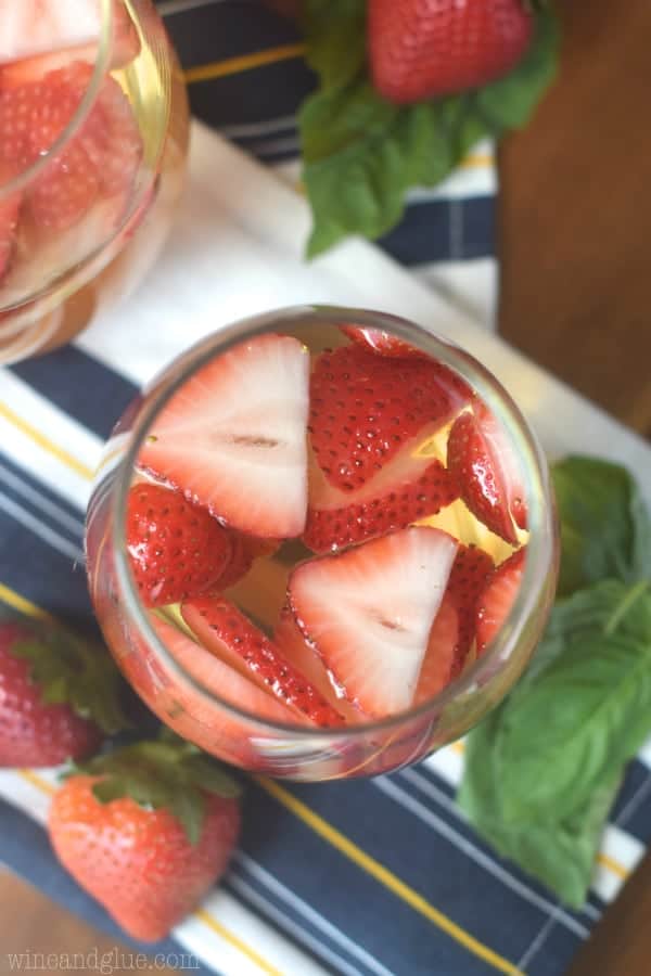 Such a perfect and easy summer cocktail! This Strawberry Basil Sangria is exactly what your summer BBQ or picnic needs!