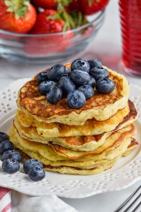 pile of yogurt pancakes with fresh blueberries on top