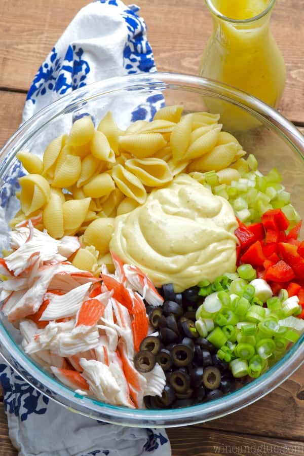 overhead photo of crab pasta salad separated by ingredients