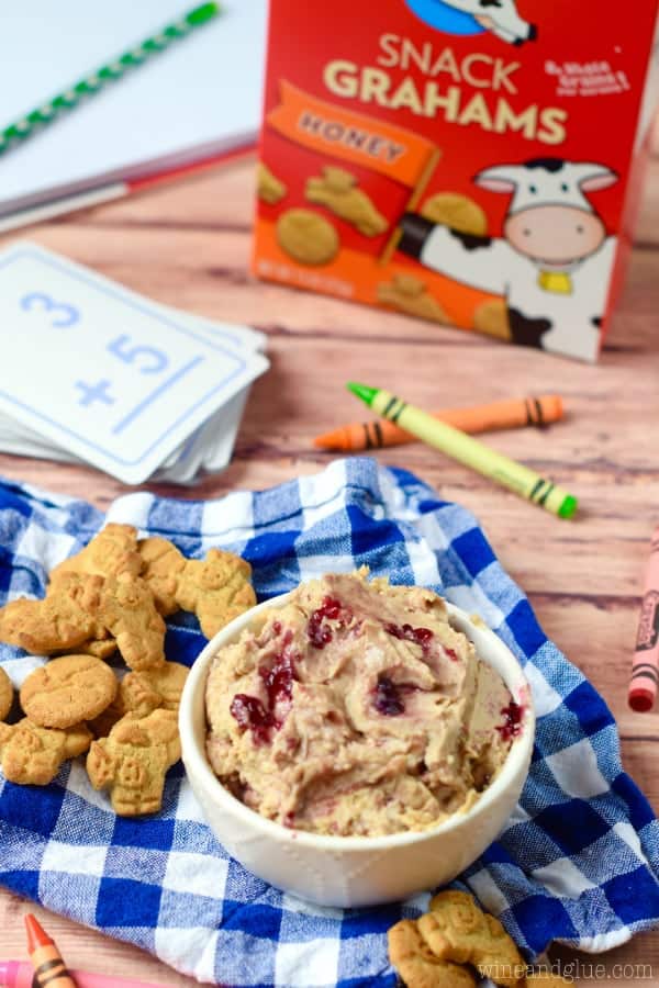 This Peanut Butter and Jelly Dip is a fun snack for the kiddos that whips up really fast and is a snack that you can feel good about.