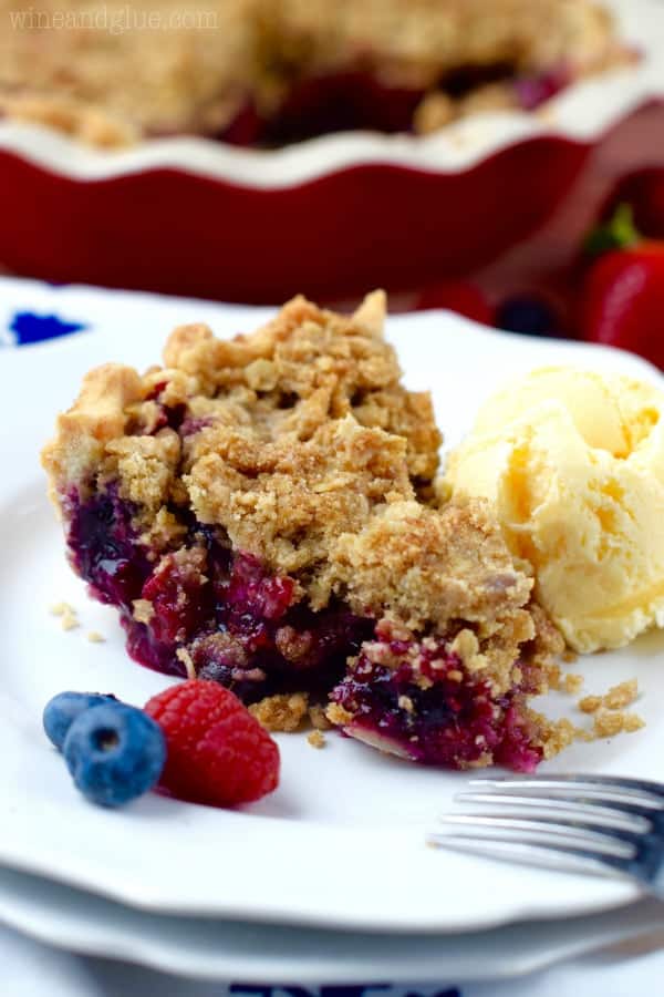 This Triple Berry Cobbler Pie combines the amazing flavors of blueberry, raspberry, and strawberries in an amazing pie with a crumble topping. It's like a cobbler and a pie combined, so good!