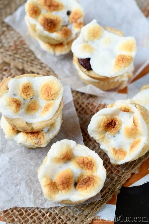 These S'mores Peanut Butter Cup Mini Pies are the deliciousness of a s'mores, smacked with a peanut butter cup, and stuffed inside a pie.  I dare you to only eat one!