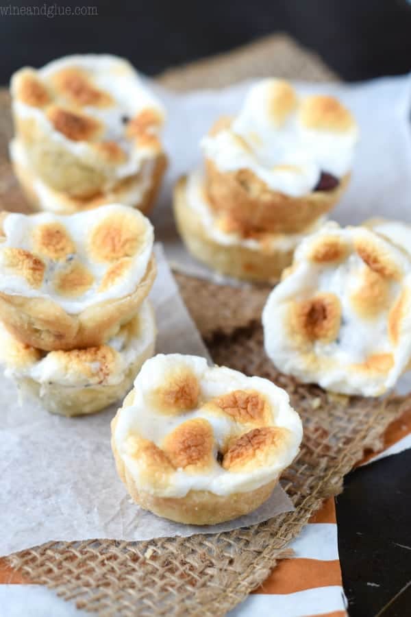 These S'mores Peanut Butter Cup Mini Pies are the deliciousness of a s'mores, smacked with a peanut butter cup, and stuffed inside a pie.  I dare you to only eat one!