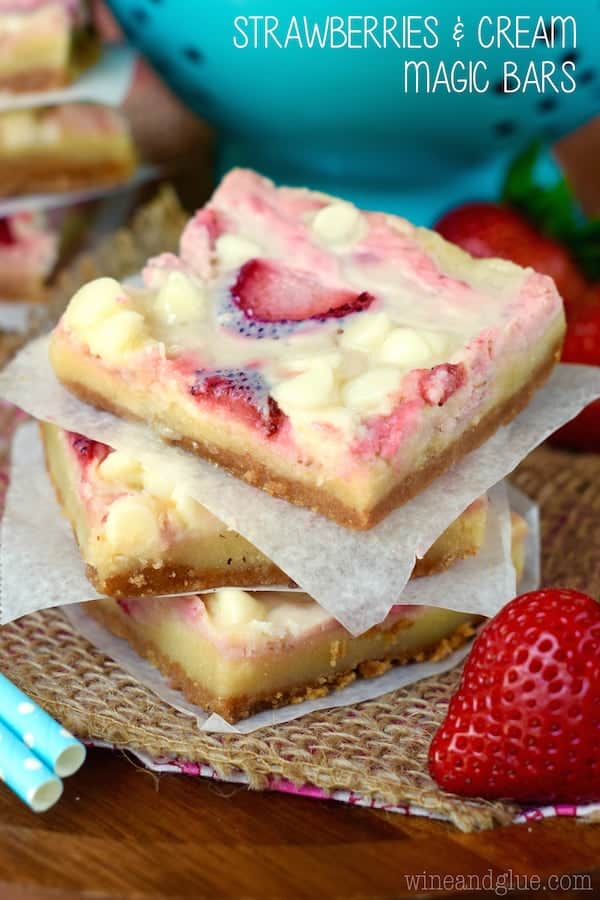 These Strawberries and Cream Magic Bars are pure magic. Made with fresh strawberries and a sugar cookie layer, they are seriously amazing!