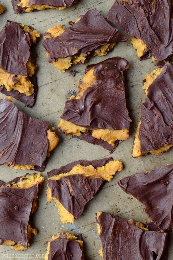 An overhead photo of the Pumpkin Cookie Dough Bark that is cut into different shards on a metal baking tray. 