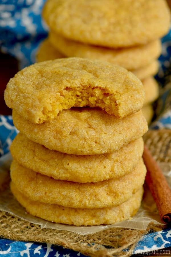 A stack of the Pumpkin Sugar Cookies has a light golden color with a hard exterior and soft interior. 