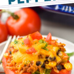 pinterest graphic of a taco stuffed pepper on a plate topped with chopped tomatoes and cilantro, says: the best taco stuffed peppers simplejoy.com