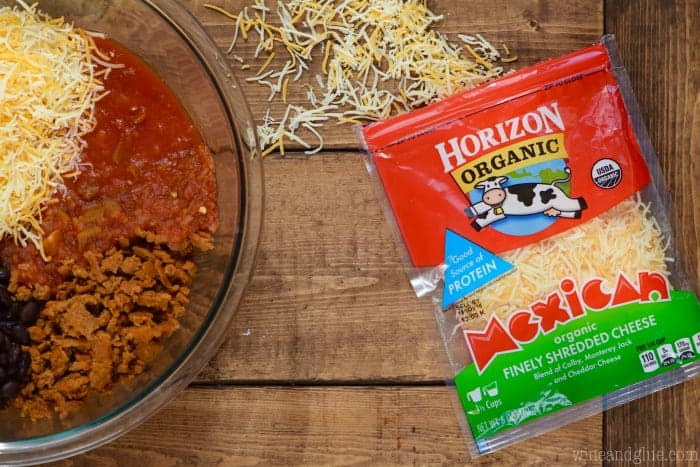 overhead photo of a bowl of ingredients for taco stuffed peppers next to a bag of horizon shredded cheese.