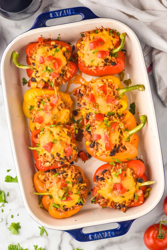 overhead of taco stuffed bell peppers in a baking dish