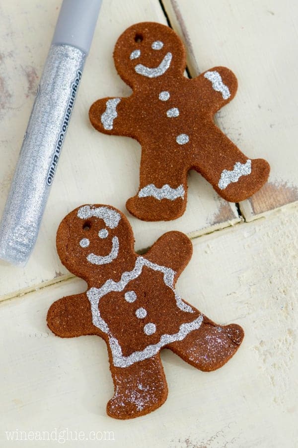 These Gingerbread Man Christmas Ornaments are such a fun easy holiday craft that smell just like gingerbread cookies! Perfect for a fun activity with the kiddos or gifting!