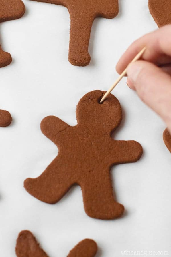 These Gingerbread Man Christmas Ornaments are such a fun easy holiday craft that smell just like gingerbread cookies! Perfect for a fun activity with the kiddos or gifting!